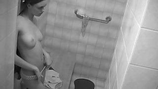 Sexy brunette teen strips nude in bathroom